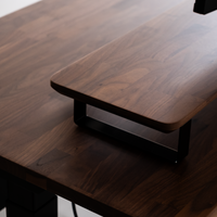Walnut desk shelf on a black desk