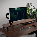 Walnut desk shelf with monitor arm on a wood desk