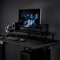 Black desk shelf gaming setup with monitor and speakers