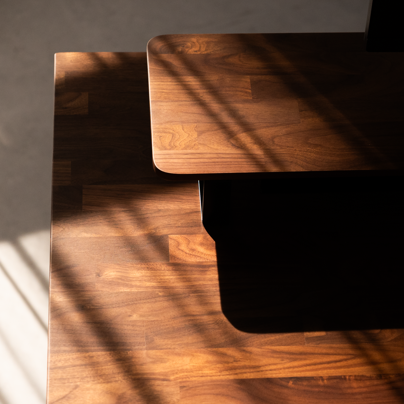 Dome standing desk — walnut grain detail
