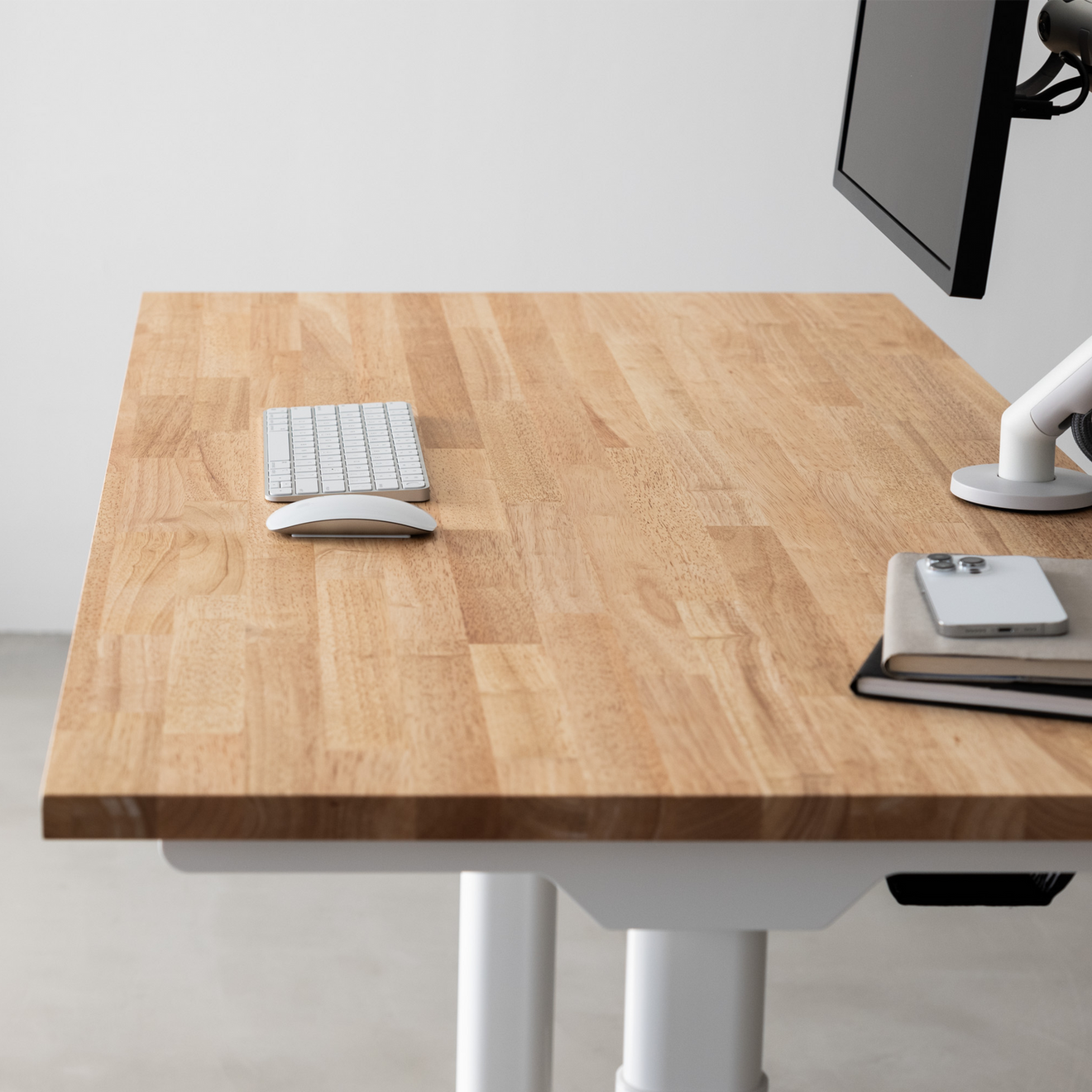 Solid wood desktop from above with keyboard