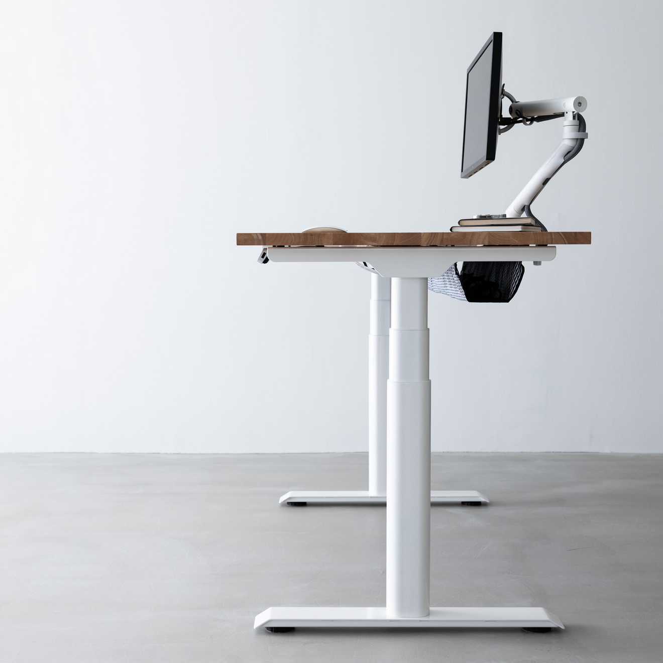 Side profile at standing height with monitor arm