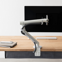 Monitor arm clamp and under-desk cable basket