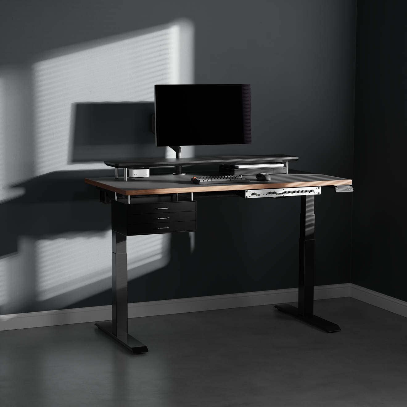 Black drawer module mounted under a standing desk