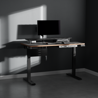 Black drawer module mounted under a standing desk
