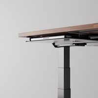 Black desk tray mounted under a desk