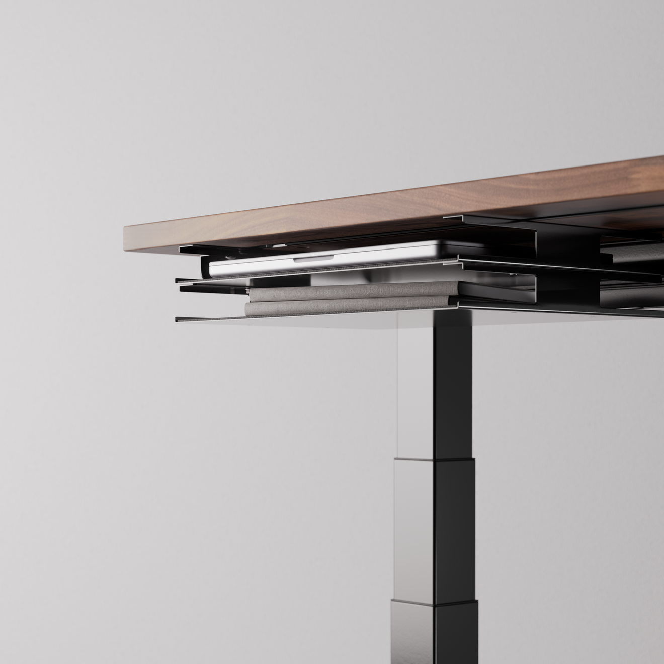 Black desk tray under-desk view