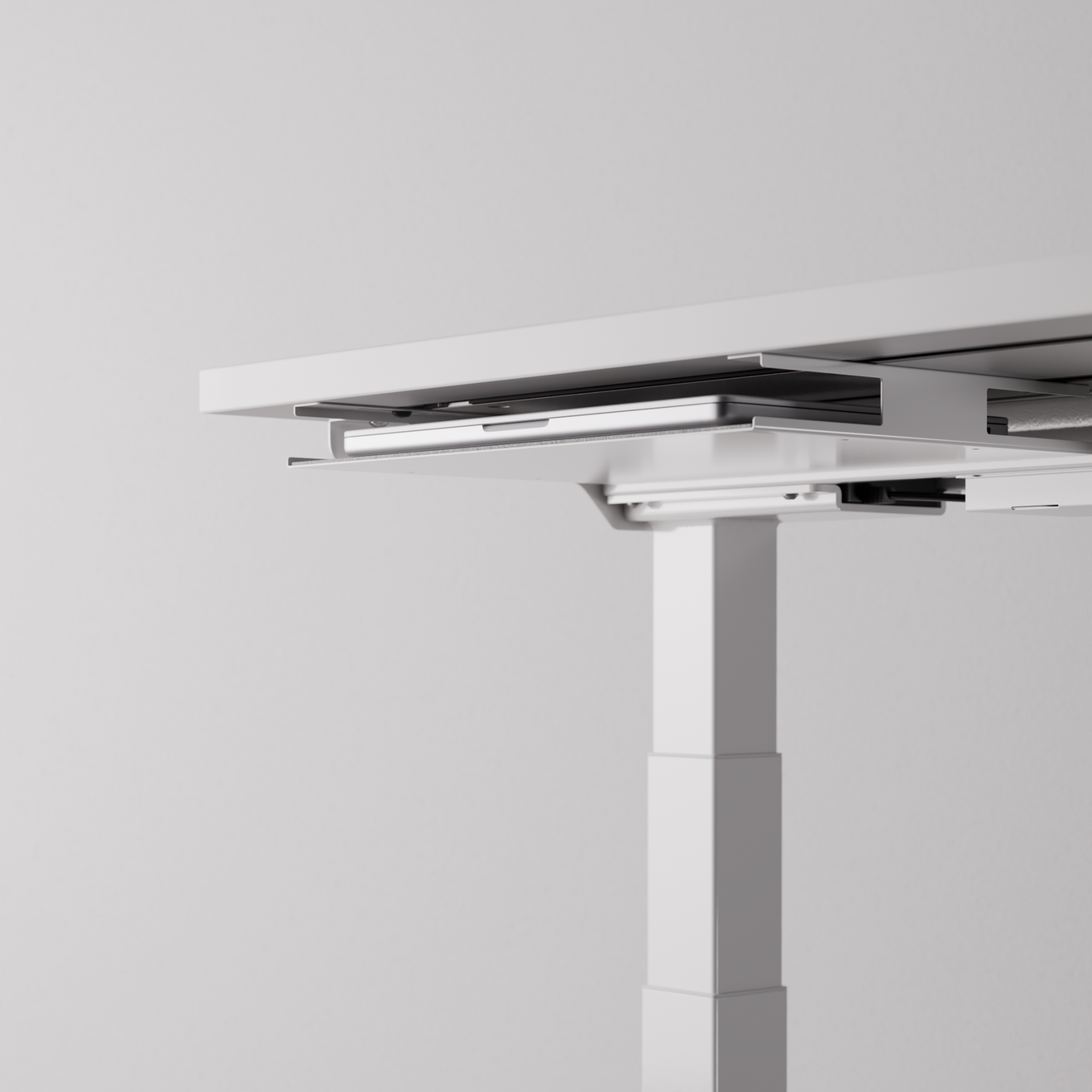 White desk tray mounted under a desk