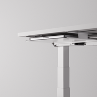 White desk tray mounted under a desk